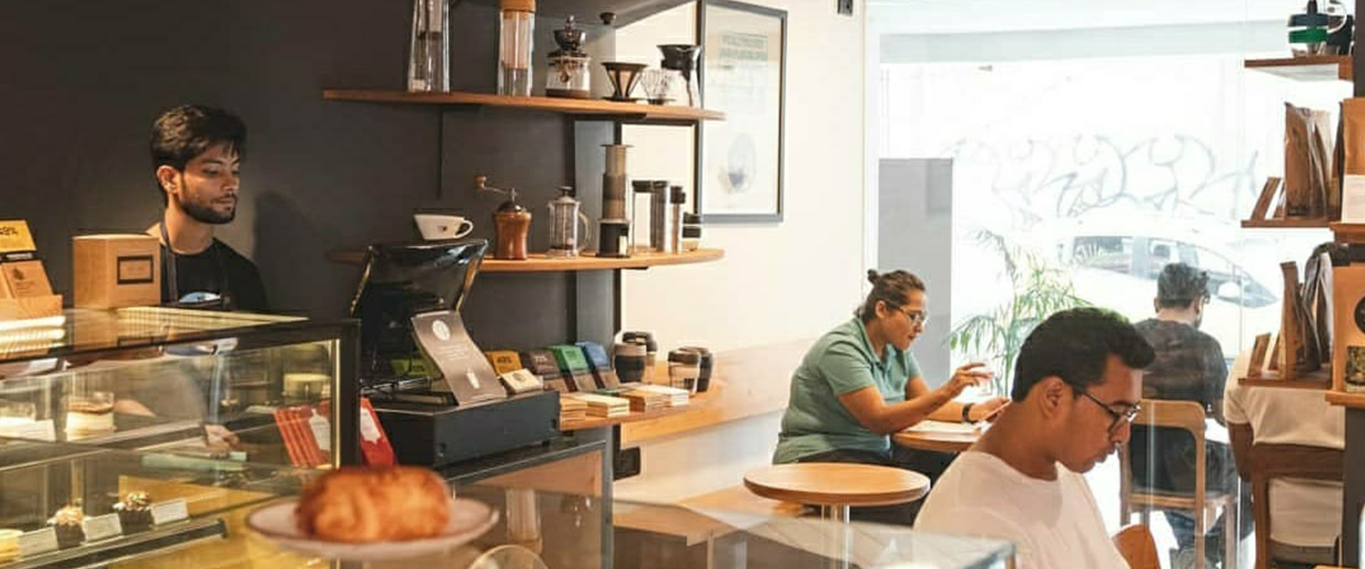 Lap and Dado Furniture for Blue Tokai Coffee - Cafe tables in birch ply with single stand legs and teak wood chair, cafe counter with glass display and shelving