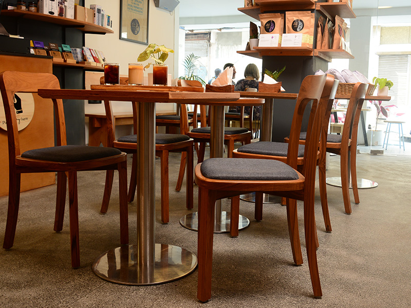 Lap and Dado Furniture for Blue Tokai Coffee - Cafe tables in birch ply with single stand legs and teak wood chairs