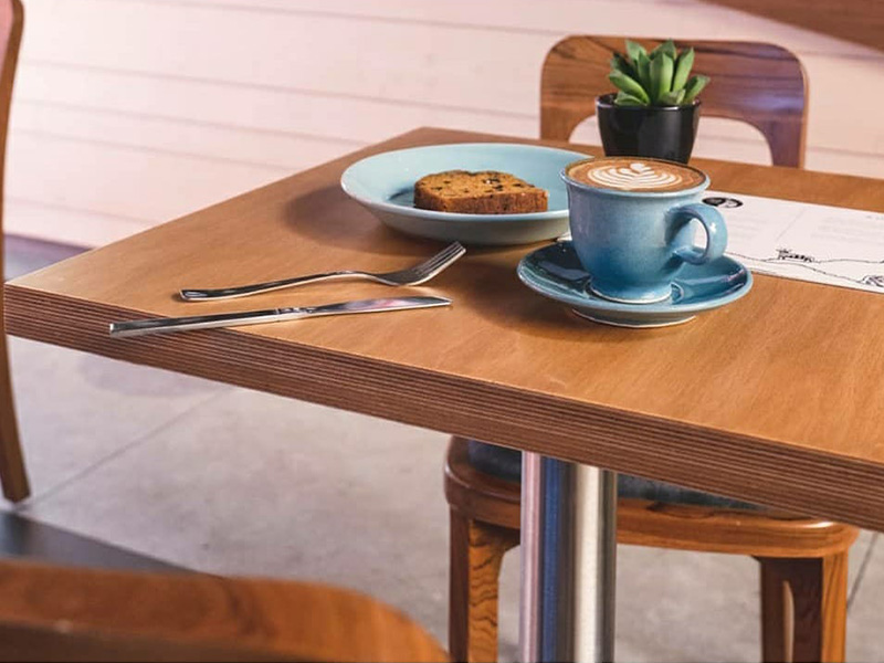 Lap and Dado Furniture for Blue Tokai Coffee - Cafe tables in birch ply with single stand legs and teak wood chairs